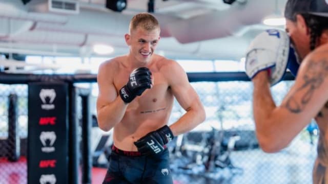 Ian Garry hits the pads in preparation for a UFC fight.